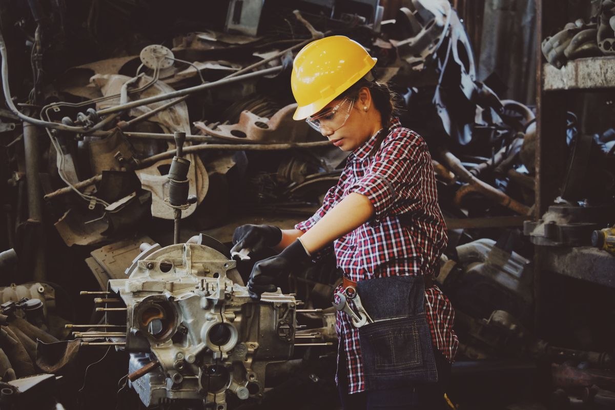 Technician repairing industrial machinery
